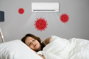 Ragazza dorme con l'aria condizionata, disegno dei batteri